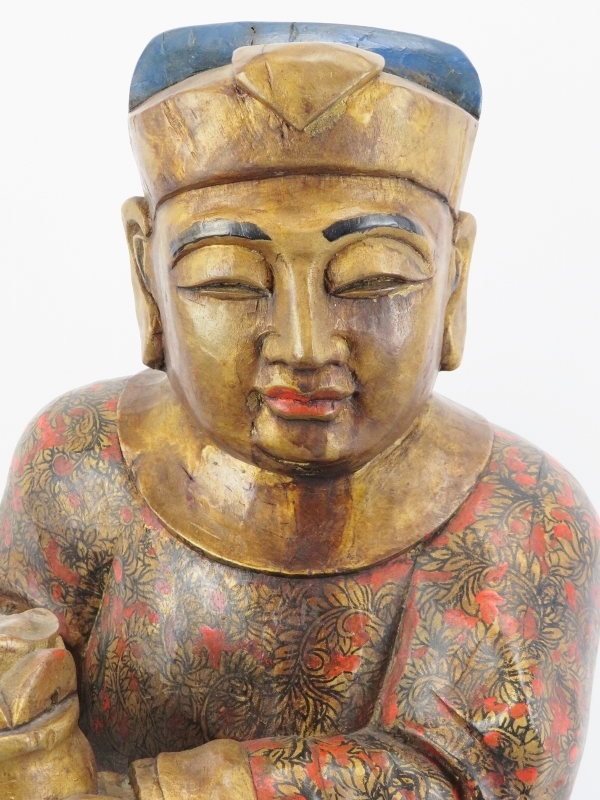 A Chinese gilt and lacquer painted carved wood figure, 20th century. Supported on a rectangular wood - Image 2 of 7