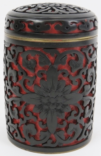 A Chinese black and cinnabar lacquer jar and cover. 3.9 in (10 cm) diameter. Condition report: