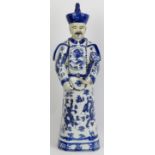 A large Chinese blue and white glazed porcelain figure of an Emperor of China, 20th century.