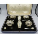 A good quality six piece condiment set comprising of two salt, two pepper and two mustard,