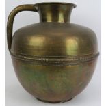 A large Middle Eastern brass jug. 14.8 in (37.5 cm) height. Condition report: Some surface wear with