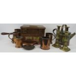 A group of brass and copper items, 19th/early 20th century. Comprising four tankards, a pouring pot,
