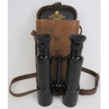 A rare pair of Dolland of London field binoculars, early 20th century. When viewed the image is