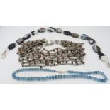 A striking faceted blue topaz bead necklace with ball clasp, contemporary but with a hint of Art