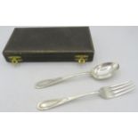 A silver christening set with spoon and fork, Birmingham 1917 & 1918, boxed. Approx weight 2 troy