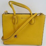 A Michael Kors bright yellow handbag with shoulder strap, with dust bag. Provenance: Part of a