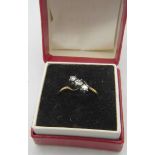 An 18ct yellow gold 3 diamond cross over ring. Approx: .2cts. Size O. Boxed. Condition report: