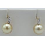 An AAAA pair of 18ct yellow gold Southsea golden pearl & diamond earrings, approx 0.17cts, VS F/G,