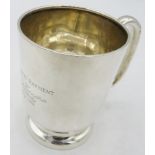 A silver christening mug with pedestal foot base, engraving on side, H.W Ltd, Birmingham 1927.