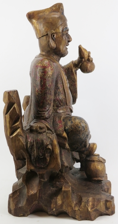 A Chinese gilt and lacquer painted carved wood figure of an immortal, 20th century. Depicted - Image 6 of 6