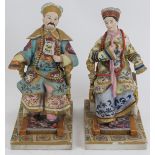 A pair of European porcelain figures depicting a Chinese emperor and empress, late 19th/early 20th