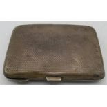 A silver card case with inside fabric sections, engraved monogram and dragon, Birmingham 1919.