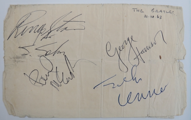 The Beatles: A page signed by all four members of the band in 1963. Clearly signed in black and blue