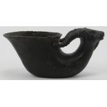 A Chinese dark patinated bronze libation cup. Carved in the form of a ram. Ming dynasty mark