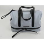 A Karl Lagerfeld pale blue handbag with black straps. Provenance: Part of a private collection of