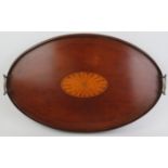 A large Edwardian oval mahogany twin handled tray. With an outer gallery and central bats wing