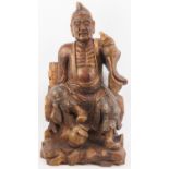 A Chinese gilt and lacquer painted carved wood figure of an immortal, 20th century. Depicted
