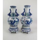 A pair of Chinese polychrome painted vases with stands, 20th century. (2 items) 18.5 in (47 cm)