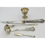 A silver handled Kings pattern cake knife, boxed, a silver Victorian ladle Edinburgh 1859, a