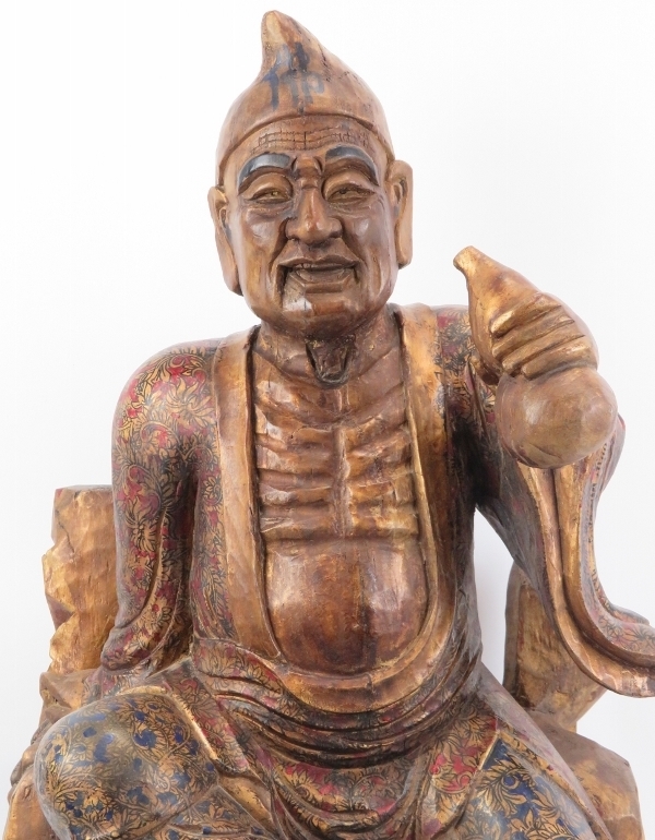 A Chinese gilt and lacquer painted carved wood figure of an immortal, 20th century. Depicted - Image 2 of 6