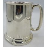 A silver 1 pint tankard with 'C' handle, Birmingham 1958, J.G Ltd. Approx weight 10.7 troy oz/338