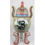 A very large Chinese Famille rose porcelain tripod censor and cover. Of ding form, the pierced domed