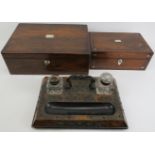 A group of three writing desk items, 19th century. Comprising a writing slope with key, desktop