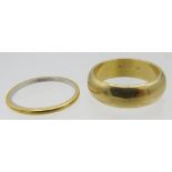 A heavy 18ct yellow gold wedding ring, size M, approx weight 8.7 grams and a platinum wedding