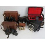 A collection of binoculars and a film camera. (5 items) Condition report: Some wear with age.