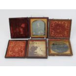 A group of three Victorian daguerreotype photographs. Each housed in leather framed cases. (3 items)
