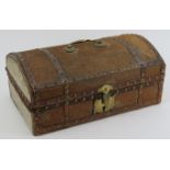 A pony skin covered casket, 19th century. The wooden frame covered in pony skin and bound with