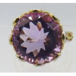 An amethyst ring, high set, faceted 16mm round cut solitaire, size Q/R, 14k yellow gold overlay