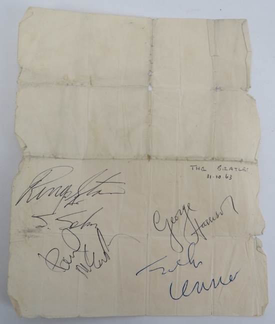 The Beatles: A page signed by all four members of the band in 1963. Clearly signed in black and blue - Image 2 of 2