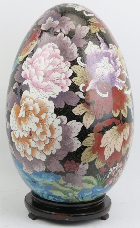 A large Chinese cloisonné enamelled egg, 20th century. Decorated with an exotic bird amongst