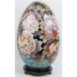 A large Chinese cloisonné enamelled egg, 20th century. Decorated with an exotic bird amongst