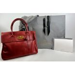 A Mulberry 'Bayswater' large deep red handbag, with dust bag. Provenance: Part of a private