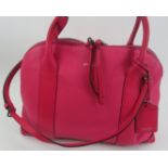 A Coach bright pink handbag with should strap, with dust bag. Provenance: Part of a private