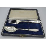 A silver christening spoon and fork, Sheffield 1957 & 1959, boxed. Approx weight 1.8 troy oz/55