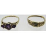 A 9ct yellow gold three stone amethyst ring, centre amethyst approx 8mm x 5mm, size P and a 9ct