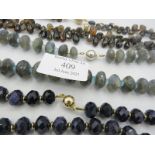 A labradorite necklace with apatite spacers and white metal ball clasp, a blue goldstone necklace