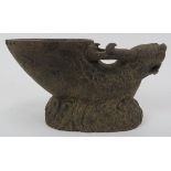 A Chinese carved stone libation cup. Carved in the form of a dragon with incised features and