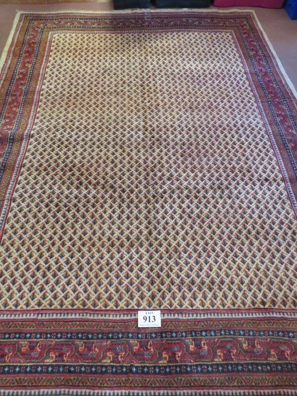 A North East Persian Sarouk Mir carpet central repeat pattern field on cream ground and deep border. - Image 2 of 3