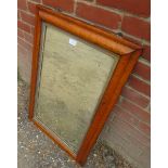 A 19th century parcel gilt rectangular wall mirror in a maple frame, retaining the original nicely