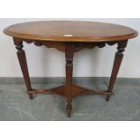 An Arts & Crafts oak and mahogany oval occasional table, on tapering square supports united by a