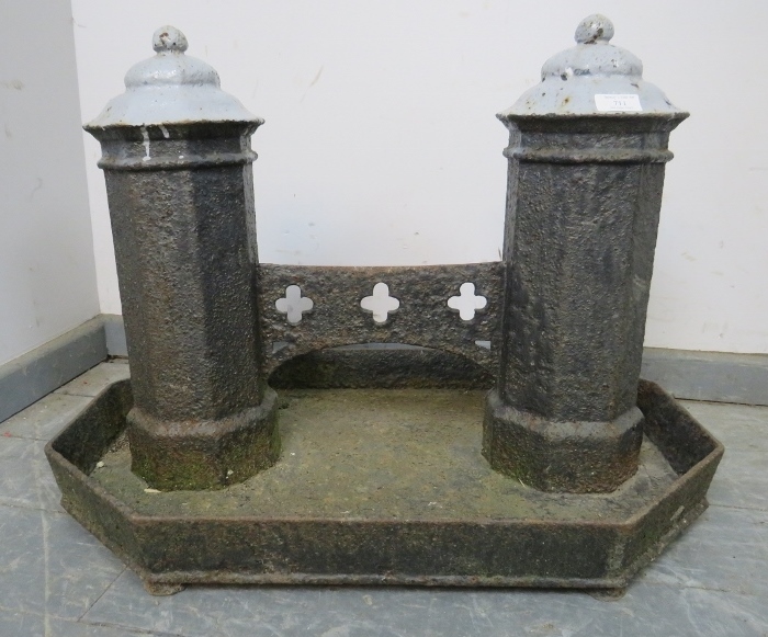 A very large 19th century cast iron boot scraper, the two octagonal columns with ball finials,