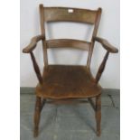 A 19th century elm and beech ‘Oxford’ elbow chair, on canted turned supports with an ‘H’