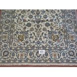 A Persian Yazd carpet, cream ground detailed with foliage and in very good condition. 252 x 150.
