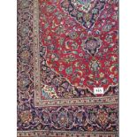 Central Persian Kashan carpet central flowered motif cream/blue on red ground. Very clean and in