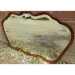An Art Deco Period bevelled wall mirror in a shaped and chamfered walnut surround. H42cm W71cm