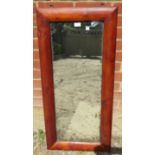 An antique rectangular wall mirror in a pitch pine surround with nicely silvered plate. H102cm W48cm